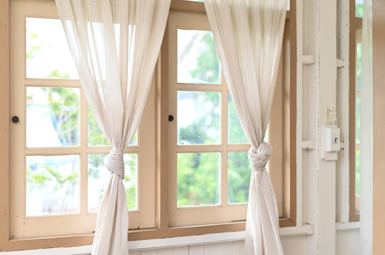 An older wooden window with drapery tied in front of it at Window Ware near Wenonah Borough, New Jersey (NJ)