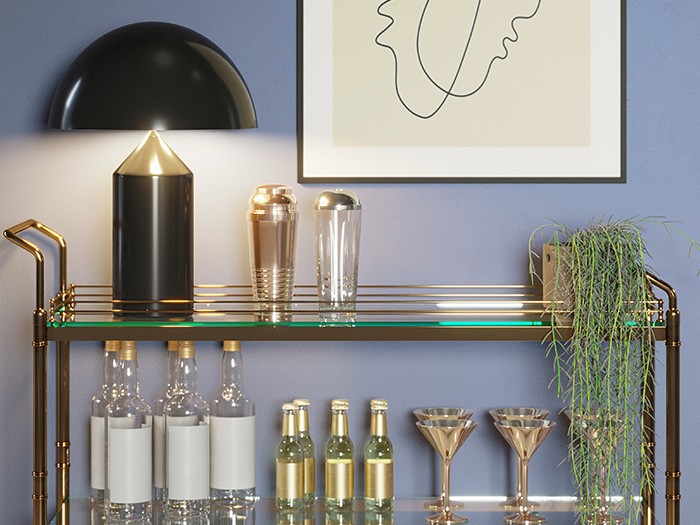 A bar cart with mixing tools and glasses.